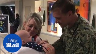 Sailor returns home to meet his newborn son for the first time