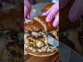 Crispy crab cake burger stacked with fresh slaw and creamy spicy sauce 🍔