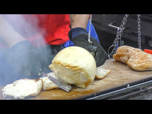 Hanged Cheese Caciocavallo Grilled and Melted on Bread. Italy Street Food