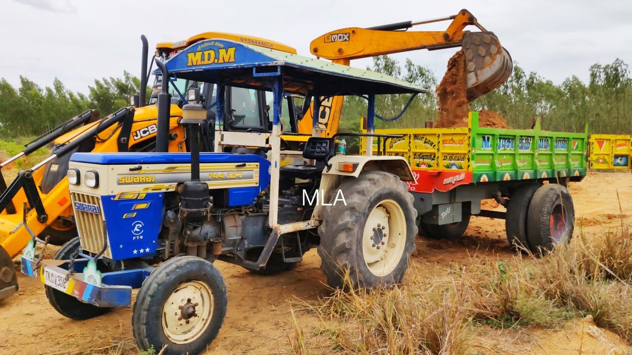 Swaraj 744 XM Tractor with Full Loaded Trolley of 744 Granite