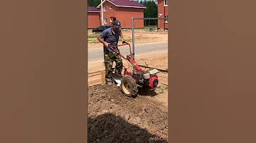 Plowing The Land With A Mini Tractor 