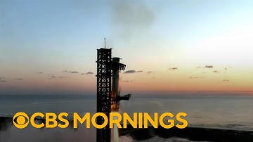 SpaceX takes step toward developing reusable rockets after successful launch and recovery