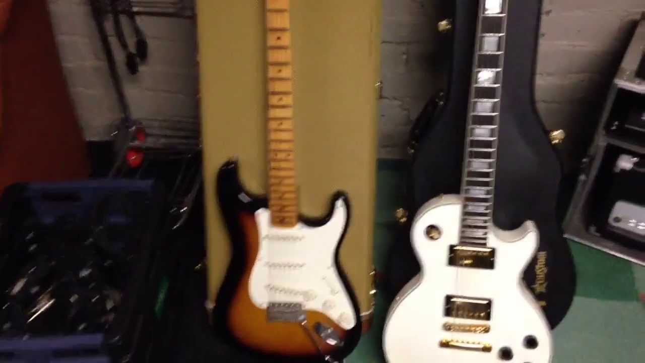 Explaining the guitar and recording equipment