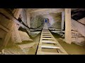 Climbing old ladders in an abandoned mine to reach a lower level part 1