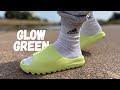 yeezy glow green slides on feet