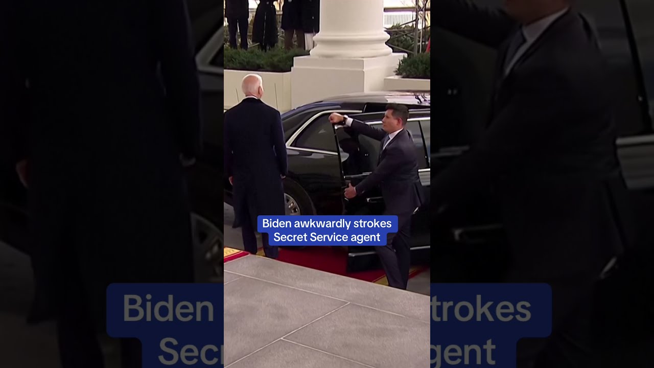 Biden Awkwardly Strokes Secret Service Agent