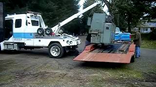 Machinery Moving with a Tow Truck