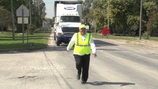 Dubbed "Cookie Flagger" Hands Out Treats to Ease Construction Blues