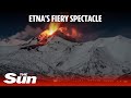 Snowy Mount Etna volcano roars into action spurting lava into night sky