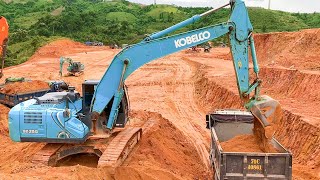 Big Blue Excavator Kobelco SK250 Loading Trucks - Mining Soil