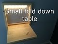 Small fold down desk with LED-light.