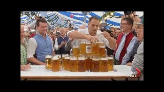 German man sets new record for carrying beer steins
