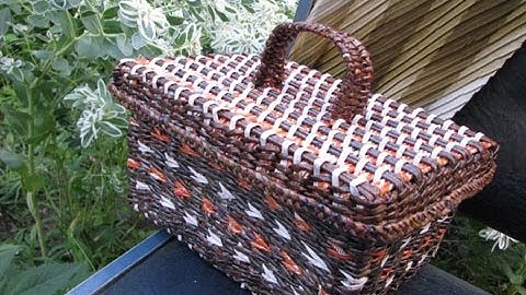 Weaving a square bottom from newspapers.  Part 1.