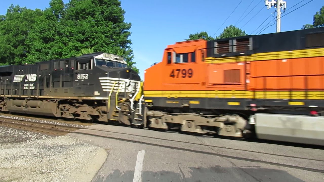 CN 2938, BNSF/GECX 4799, NS 8152 haul an Eastbound freight
