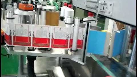 Round bottle front and back sides labeling machine clip