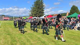 Scotland the Brave as Drum Major leads Forres Pipe Band march during 2026 Dufftown Highland Games