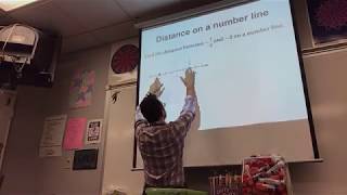 Finding the distance between two points on a number line video
