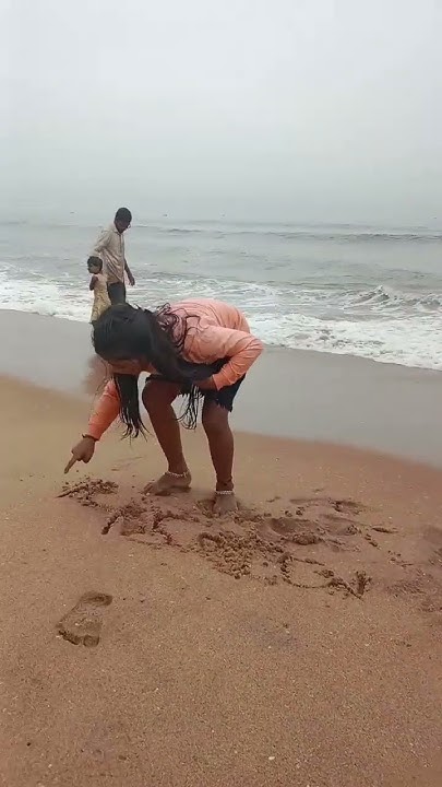 Doshini Writing Name On Beach - YouTube