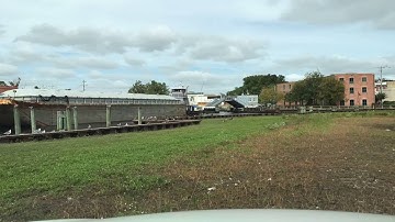 Time-lapse of tugboat barge going through double drawbridge