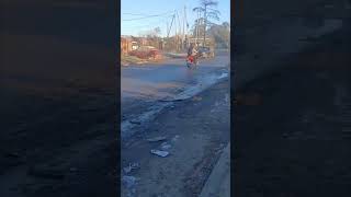 Motorcyclist Slips on Wet Road, Falls Off Motorcycle