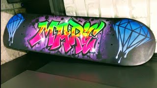 Airbrush graffiti on a skateboard