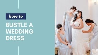 How to Bustle a Wedding Dress • How To Videos