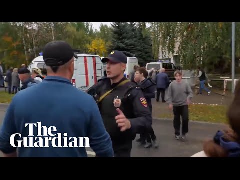 Children evacuate from school in russia after deadly shooting