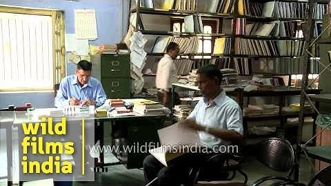 Visually challenged man walking with stick at Central braille press