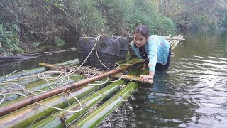 Poor girl. harvesting fish and Green vegetables to sell in the village