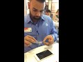 Unintentional asmr employee applying screen protector