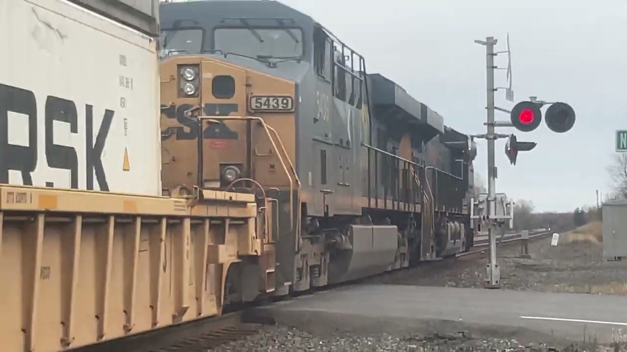 CSX 3223 leads a long eastbound stacker through kirkville with a Horn show