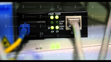 Details of UTP and other cables, blinking LED lights and RJ 45 on working Ethernet switches