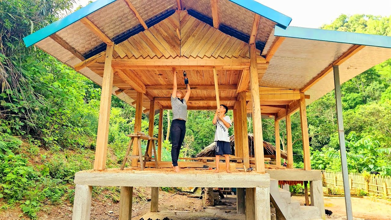 The single mother used 500 old planks of wood to make the ceiling of her wooden house.