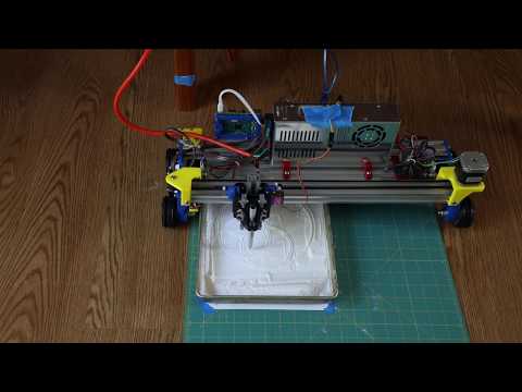 Rolling Plotter creating Flower of Life Design in pan of Baking Soda