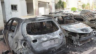 Scores of vehicles destroyed and buildings damaged by rockets in southern Israeli city of Ashkelon screenshot 5