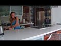 Girl sneezing in kitchen