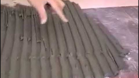 How to use a trowel to spread adhesive