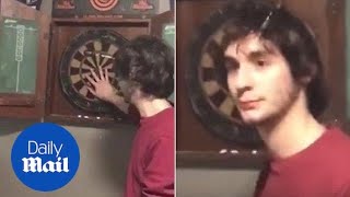 Dart flies into man's HEAD... but he doesn't seem to notice - Daily Mail screenshot 3