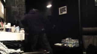 X-Clan's DJ Ultraman dances backstage at the Hip Hop Gods Classic Tourfest Revue