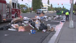 Garbage truck catches fire, dumps trash in north Fresno