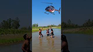 While The Village Boys Were Bathing In The Pond, They Suddenly Saw A Helicopter