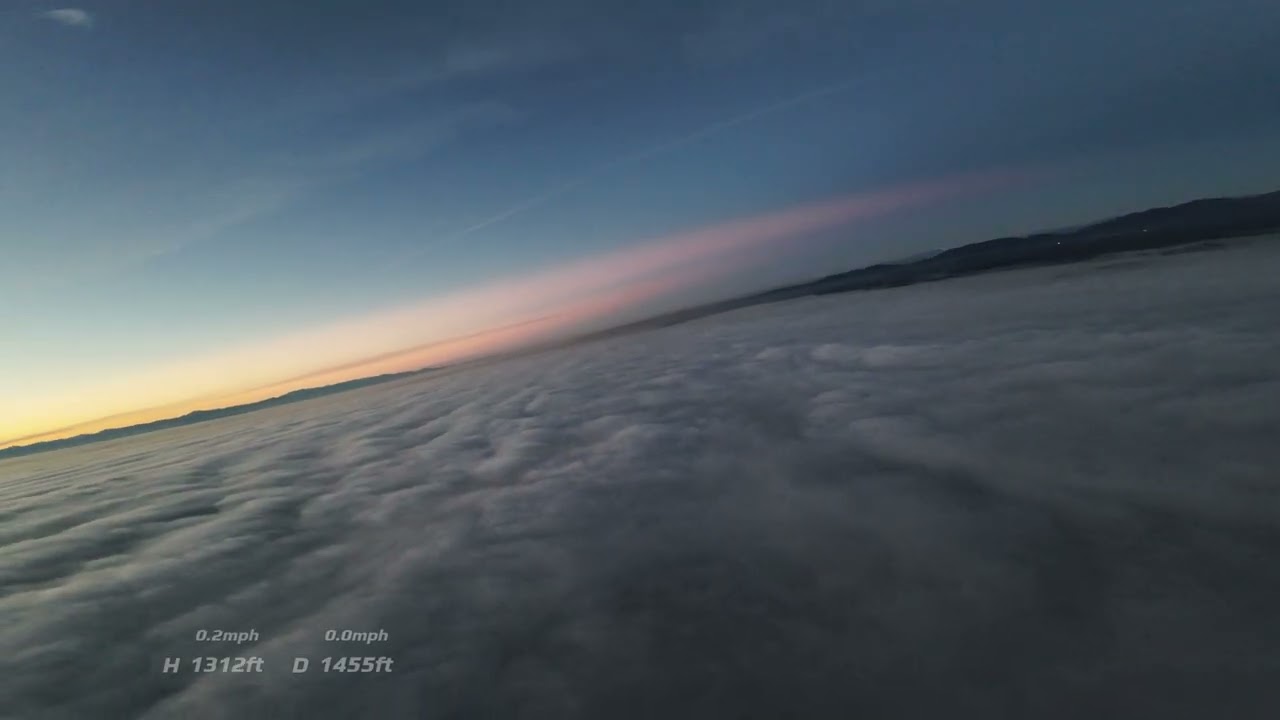 Sunset Flight Over the Fog