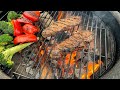 Wood fire new york strip steaks on the kamado grill