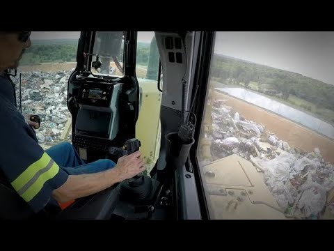 Operator Eye View While Pushing Trash with Cat® D6 XE Dozer