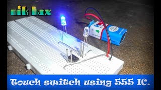 Touch switch using 555 ic on breadboard output  - by nik hax