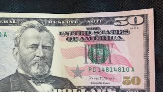 Real money. Not fake. USD 50. $50.00 American Dollar front and back.