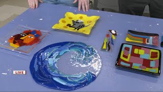 Keith Kaiser admires the different kinds of pieces made at the Glass Mosaics class