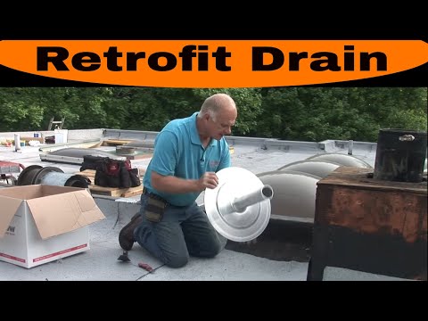 Installing a retrofit drain on a commercial roof