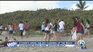 Students spend the day cleaning up the beach