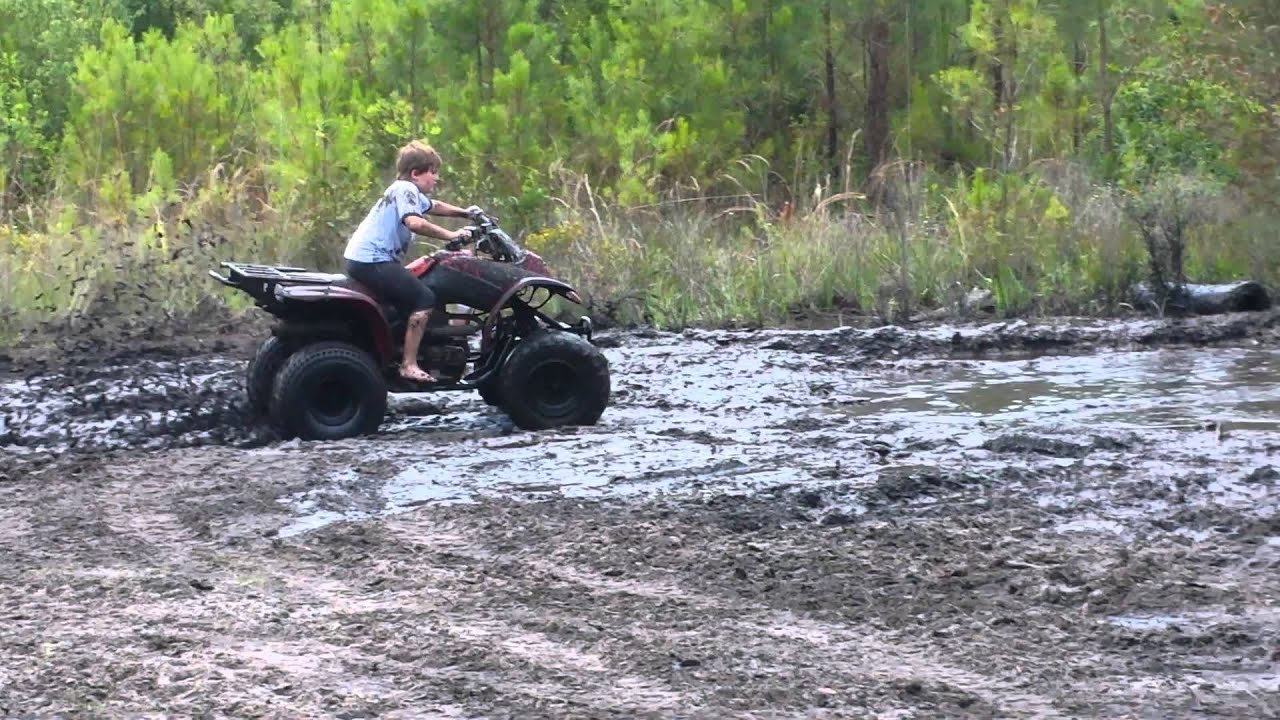 Michael driving Riley's 4 wheeler mud bogging YouTube